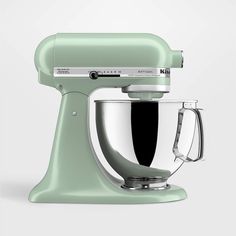 a green kitchen mixer on a white background