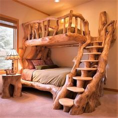 a bed made out of logs with stairs