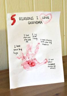 a child's handprint on a piece of paper that says reason i love grandma