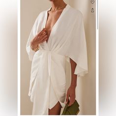 Great Dress! Worn 2x For Short Periods Of Time. Online At Moda Operandi For $255 For Preorder Elegant White Wrap Dress For Beach, Elegant White Beach Wrap Dress, White V-neck Wrap Dress For Vacation, White Wrap Dress For Daywear, White Wrap Day Dress, Chic White Wrap Dress For Day Out, White Wrap Dress For Brunch, Chic White Wrap Dress For Beach, Chic White Beach Wrap Dress