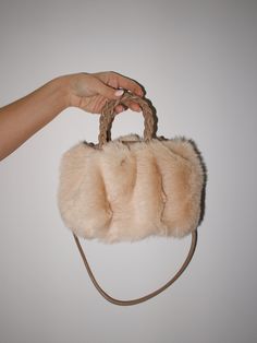 Elevate your style with our luxurious Fur Crossbody Bag. This statement piece features a soft, fuzzy exterior contrasted by a braided handle and thin shoulder strap. Compact and trendy, it's the perfect accessory to accentuate any formal or elevated look. Accessorize in class and sophistication. Trendy Boutique Clothing, Lane 201, Trendy Boutique, Fashion Marketing, New Trends, Boutique Clothing, Statement Pieces, Crossbody Bag, New Arrivals