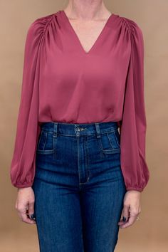 Embrace elegance and femininity with our Rouge Blush Blouse. Featuring a split neck, delicate shoulder details, and gathered cuffs, this blouse is made from gorgeous flowing fabric. Elevate your style and feel confident in this must-have piece. Fit: true to size, Amber is modeling size small. Contents: polyester blend Imported. Blush Blouse, Nickel And Suede, Flowing Fabric, Velvet Heart, How To Make Handbags, Ethical Fashion, Feel Confident, Purses And Handbags, Jean Shirts