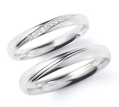 two white gold wedding rings with diamonds