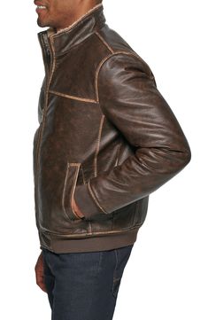 Ultrasoft faux-shearling lining offers ultimate warmth into this faux-leather jacket styled with handy pockets. 27" length Front zip closure Stand collar Front welt pockets Water resistant Lined, with synthetic fill 100% polyurethane with 100% polyester faux shearling Machine wash, tumble dry Imported Rugged Leather Jacket With Zipper For Winter, Winter Leather Biker Jacket With Faux Pockets, Rugged Winter Biker Jacket With Zipper Closure, Rugged Leather Outerwear With Zipper Closure, Brown Leather Jacket With Zipper For Cold Weather, Casual Leather Jacket With Faux Fur Lining, Brown Leather Outerwear With Zipper Closure, Casual Leather Jacket With Zipper For Cold Weather, Rugged Outerwear With Zipper For Fall