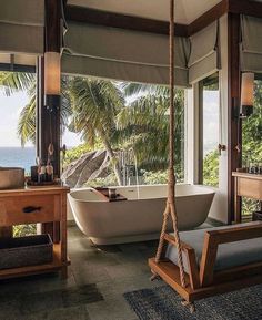 an instagram photo of a bathroom with a hammock hanging from the ceiling