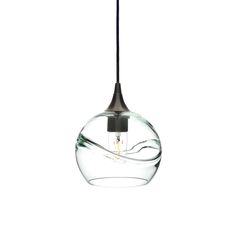 a glass light hanging from a ceiling fixture