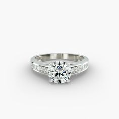 a white gold engagement ring with diamonds on it