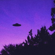 an object is flying in the purple sky