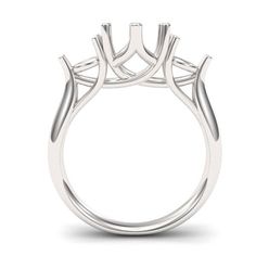 a white gold ring with three stones on the side