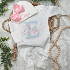 This Personalized baby outfit set will make a wonderful, personalized baby gift for the proud parents. The outfit is the perfect coming home outfit for the new bundle of joy and will be a cherished family keepsake. The sets can include a gown, footie, bodysuit, beanie hat, headband with bow,  and bib. You can also add a blanket and I will make it match the embroidered set.   ♥RUSH MY ORDER♥ Add this listing to your cart along with your items. https://etsy.me/3dbKtZh ♥PRODUCTION TIMES♥ My current Customizable Cotton Sets For Baptism, Customizable Fitted Sets For Baptism, Personalized Fitted White Sets, Personalized Fitted White Set, Personalized White Cute Sets, Coming Home Outfit Boy, Hat Headband, Baby Girl Outfit, Personalized Baby Girl