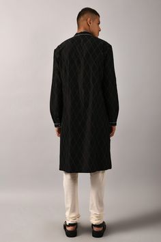 Black straight kurta with all-over stitch lines in checkered pattern. Comes with ivory cotton churidar.
Components:2
Embroidered
Neckline:Mandarin Collar
Sleeve Length:Full
Fabric:Linen Cotton
Color:Black
Buttoned placket
Stitch lines
Side slits
Cuff sleeves
Checkered pattern - Aza Fashions Black Cotton Sherwani With Straight Kurta Shape, Black Cotton Sherwani Straight Kurta, Designer Cotton Sherwani With Straight Kurta, Designer Cotton Kurta For Eid, Designer Cotton Straight Kurta, Designer Black Straight Kurta, Designer Cotton Bandhgala Straight Kurta, Designer Cotton Bandhgala In Straight Kurta Style, Cotton Churidar