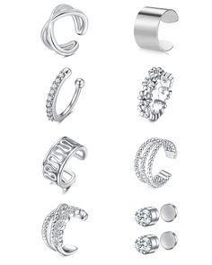 six different types of rings on a white background, each with diamonds in the middle