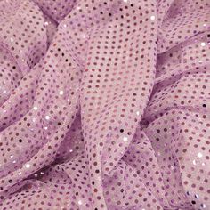 This polyester sequin fabric is sure to add pizzazz to any costume, from dance recital dresses to fun purses to Halloween costumes! The lovely metallic sheen is offset beautifully by the see-through polyester backing. Perfect for layering, it's very light weight but surprisingly resistant to tearing. A lovely, liquid draping quality adds to the enchantment! It's the perfect material for Disco Night, cheer bows, Halloween and dance costumes. Purple Sequin Fabric For Spring Party, Spring Disco Sequin Fabric With Glitter, Metallic Glitter Sequin Fabric For Spring, Spring Disco Glitter Sequin Fabric, Spring Metallic Glitter Sequin Fabric, Pink Glitter Sequin Fabric For Spring, Pink Glitter Sequin Fabric For Summer, Purple Sequin Fabric With Glitter Print For Party, Summer Pink Sequin Fabric With Glitter