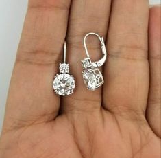 Specification:- *Diamond Material : Cubic Zirconia ( CZ ) *Diamond Shape : Round *Total Diamond Weight : 4.41 CT *Diamond Dimension : 3.50, 8.00 MM *Diamond Color : White *Clarity : VVS *Making Process: Handmade by our Experienced Staff. *Stamp: Our All Earring Stamped According to metal Purity (925 SIL). Cancellation Policy :- * Order cancellation request will be accepted within 24 Hours  after order placed. After that we will not accept order cancellation request. Important & Notes:- *Our all Jewelry is handcrafted in such a way that it gives special touch to your dream gift *All listed jewelry in our store are made to order. *Our All Jewelry are rhodium plated. *Our All Item Packed in Jewelry Boxes. Return & Refund:- *We do accept return / exchange item only in case of item is damaged o Aesthetic Jewellery, Round Diamond Earrings, Nouveau Jewelry, Jewelry Designing, Stone Dangle Earrings, Solitaire Earrings, Moissanite Earrings, Jewellery Ideas, Anniversary Gifts For Wife