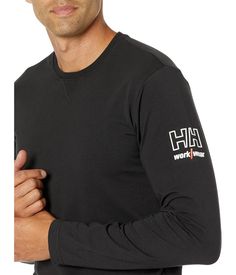 Experience the lightweight comfort of the Helly Hansen® Kensington Long Sleeve shirt, an essential piece for transition seasons!.Crewneck tee with rib-knitting at center front..Full-length sleeves featuring branding at left bicep..92% cotton, 8% elastane..Machine washable..Imported..Product measurements were taken using size MD. Please note that measurements may vary by size..Measurements: Length: 30 in Chest Measurement: 40 in Sleeve Length: 25 in Crew Neck T-shirt With Ribbed Cuffs For Loungewear, Sporty Branded T-shirt For Fall, Casual T-shirt With Ribbed Cuffs For Everyday, Casual Everyday T-shirt With Ribbed Cuffs, Long Sleeve Logo Print T-shirt For Loungewear, Athleisure Crew Neck T-shirt With Ribbed Cuffs, Relaxed Fit Long Sleeve Work T-shirt, Relaxed Fit Long Sleeve T-shirt For Work, Relaxed Fit Crew Neck Top For Work