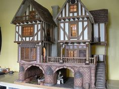 two model houses made out of wood and brick