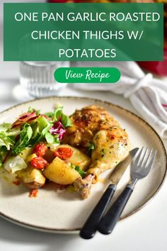 one pan garlic roasted chicken thighs w / potatoes on a plate with salad and fork