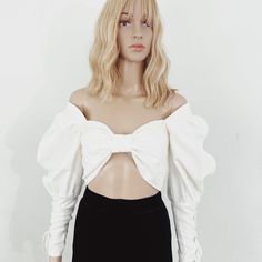 Elevate Your Style With The Seraphim Lace-Up Bow Top From Sustainable Fashion Brand Nathalia Jmag.&Nbsp; The Linen Top Features A Front Bow Bralette And Puffed Sleeves. The Meticulous Details Truly Set This Piece Apart, Adorned With Lace-Up Sleeve Cuffs And An Adjustable Corset Style Lace-Up Back With Oversized Grommets. Yet, Beyond Its Aesthetic Splendor Lies A Deeper Commitment. Crafted From Deadstock Fabric And Tailored To Order Or Sewn In Small Batches, Each Nathalia Jmag Creation Embraces Sustainability Without Compromise. Because True Style Isn't Just About Making A Statementit's About Making A Difference, One Impeccably Crafted Garment At A Time. ****Note- The Xs And Small Are Br Sleeveless High Neck Blouse, Deadstock Fabric, High Neck Blouse, Bow Top, Sustainable Fashion Brands, Making A Difference, Embroidered Jacket, Woven Top, Corset Style