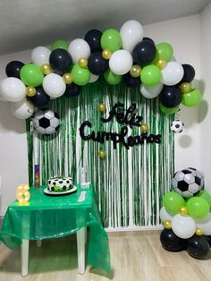 a soccer themed birthday party with balloons and streamers