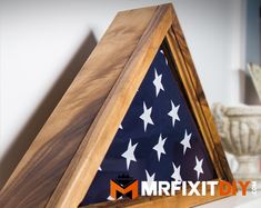 a wooden triangle with an american flag on it and the words mrfxit diy