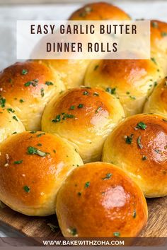 garlic butter dinner rolls on a wooden platter with text overlay that reads easy garlic butter dinner rolls