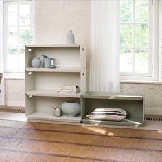 an empty shelf in the corner of a room