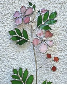 a close up of a flower on a wall