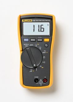 an electronic multimeter on a white background