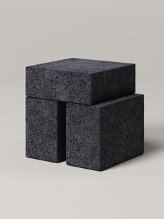 three black blocks stacked on top of each other