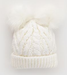 This sweet cable knit hat in a creamy white color is topped with 2 dyed-to-match furry pom poms. We think this is adorable for the holidays. It makes a great photo prop too. We offer this in other colors as well.    100% Acrylic;   Cold handwash;   Hand knit in China; Cute Winter Hats, Cable Knit Hat, Newborn Hat, Recycled Yarn, Faux Fur Pom Pom, Knit Beanie Hat, Cute Hats, Winter Fun, Pom Pom Hat