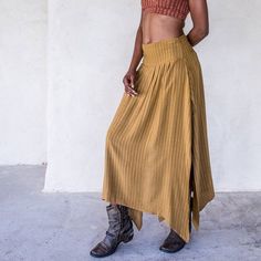 The IDIS Abby Skirt in Tumeric is a Mid rise skirt with high side splits and smocking in the back creating an elasticised waiste band for extra comfort.Made from a medium weight woven Rayon.Part of the Graceful Rebellion Range.SIZE GUIDE XS: bust 76-82 cm | waist 64-70 cm | hips 78-84 cmS: bust 82-84 cm | waist 70-76 cm | hips 84-90 cmM: bust 84-88 cm | waist 76-82 cm | hips 90-96 cmL: bust 94-100 cm | waist 82-88 cm | hips 96-102 cmXL: bust 100-106 cm | waist 88-104 cm | hips 102-108 cmDELIVERY Long Skirt Pleated, Mid Rise Skirt, Ship Life, Mustard Skirt, Mens Workout Pants, Festival Pants, Hippie Skirts, Cotton Bras, Skirt Pleated