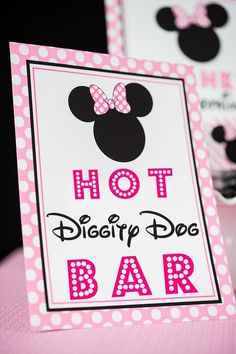 a pink and black minnie mouse birthday party sign