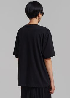 Color: Black Midweight t-shirt Boxy fit Crew neckline Drop shoulders Straight hem Unlined 100% Cotton Machine Wash Cold By The Frankie Shop. Imported Black Boxy Cotton Top, Black Relaxed Fit Basic Top, Casual Boxy Black Top, Black Boxy Fit Graphic Tee, Black Oversized Basic Tops, Basic Black Oversized Tops, Boxy Black Cotton Top, Black Boxy Fit Top With Graphic Print, The Frankie Shop