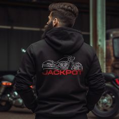 Hoodies for Victory Arlen Ness Jackpot Motorcycle Riders Stay warm while riding your motorcycle with this high-quality Victory Arlen Ness Jackpot hooded pullover designed to be the perfect source of warmth and comfort during your motorcycle journeys. This hoodie serves as the ultimate homage to these legendary motorcycles that have stolen the hearts of riders worldwide. Crafted with a three-panel fleece lining, this pullover hoodie ensures durability as you ride. Double stitched for added strength, it offers ample room for your riding movements. You can also find t-shirts with this same design in our shop. Whether you're a dedicated enthusiast of this bike or simply a lover of motorcycles, this hoodie is an excellent way to express your affection for these iconic bikes. With a variety of s Casual Hooded Outerwear For Motorcycling, Biker-style Hooded Jacket For Outdoor, Biker Style Hooded Jacket With Long Sleeves For Outdoor, Biker Style Long Sleeve Hooded Jacket For Outdoor, Outdoor Long Sleeve Biker Hooded Jacket, Winter Biker Hoodie, Biker Style Long Sleeve Hoodie For Streetwear, Black Biker Style Hoodie, Biker Style Hoodie For Streetwear