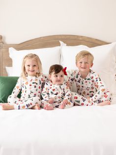 Celebrate the magic of the holiday season with our Family Pajamas. Perfect for creating sweet, lasting memories with your family, these matching pajamas bring a sense of togetherness and festive cheer. Made from our signature ButterSoft fabric, you'll stay cozy and comfortable, whether you're decorating the tree, baking cookies, or enjoying a holiday movie night together. Sizing Model is wearing YS. YS = 6/7 | Chest 22.75", Waist 20.75", Hips 22", Inseam 28" YM = 8 | Chest 24.5", Waist 22.5", Hi Family Matching Christmas Bedtime Sets, Matching Christmas Bedtime Sets, Family Matching Christmas Sleep Sets, Family Matching Christmas Sleepwear Sets, Playful Long Sleeve Christmas Sleepwear, Holiday Family Matching White Sleepwear, Family Matching Holiday Loungewear Sets, Family Matching Loungewear Sets For Holidays, Holiday Playful Sleepwear