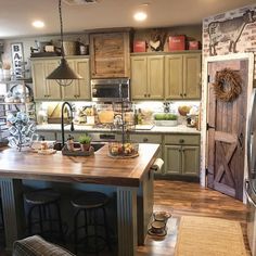 a kitchen with wooden floors and green cabinets