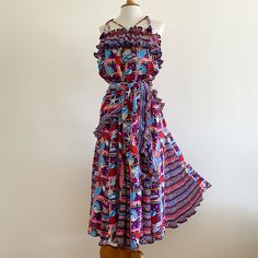 Rare vintage 1980s Diane Freis georgette dress has two sets of tasseled beaded straps which can be worn in different ways -- or strapless. Print is colorful and seashell themed with micropleated georgette ruffles and triangular inset panels in the skirt to create extreme fullness. There is a separate triangular shawl which can also be worn as a sash. Poly georgette, made in Hong Kong. In excellent condition with no fabric flaws. Elastic at the bust has failed and can be replaced (or the unstretc Bohemian Evening Dress With Spaghetti Straps, Bohemian Strapless Evening Dress, Bohemian Spaghetti Strap Evening Dress, Bohemian Multicolor Midi Dress With Spaghetti Straps, Bohemian Midi Dress With Ruffles For Party, Multicolor Bohemian Midi Dress For Evening, Bohemian Multicolor Midi Evening Dress, Bohemian Multicolor Midi Dress For Evening, Bohemian Ruffled Dress For Cocktail