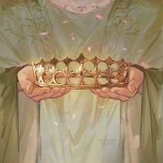 a person holding a golden crown in their hands