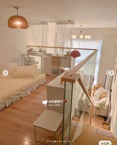 a bedroom with wooden floors and white walls