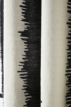 black and white striped fabric with fringes