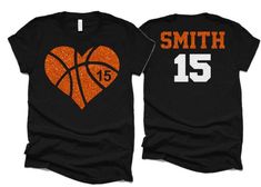 two basketball shirts with the number 15 and an orange heart on them, both in black