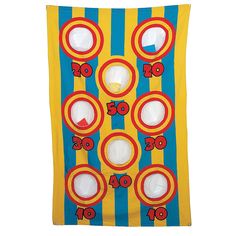 a yellow and blue striped wall hanging with numbers on the front, two white circles at the center