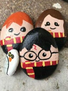 three painted rocks with harry potter characters on them