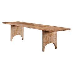 a large wooden table sitting on top of a white floor