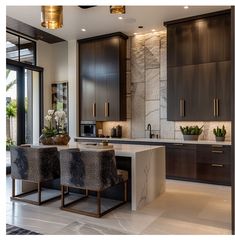 a modern kitchen with marble counter tops and dark wood cabinetry, along with an island in the middle