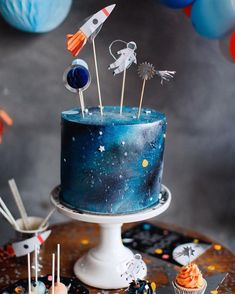 a space themed birthday cake on a table