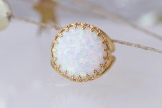 WHITE OPAL RING, Big Stone Ring, October Birthstone Jewelry, Ring With Gemstone, Gold Filled Ring, Anniversary Ring, Opal Statement Ring . Details of item: Metal: 14k gold filled Gemstone: white opal OR light blue stone Front Size: 16 mm Available all size us The ring will be packed in a gift box. , FOR MATCHING EARRINGS HERE: https://www.etsy.com/il-en/listing/271149965/white-opal-gold-earrings-for-bride?ga_search_query=FIRE+OPAL+EARRINGS&ref=shop_items_search_21 FOR ALL OPAL RING HERE: htt Ring With Gemstone, Opal Statement Ring, Fire Opal Earrings, October Birthstone Jewelry, Big Stone Ring, Ear Crawler Earrings, White Opal Ring, Lace Ring, Ring Opal