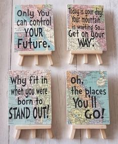 four small wooden eases with words on them