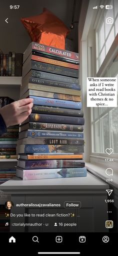 a stack of books sitting on top of a window sill next to a book shelf