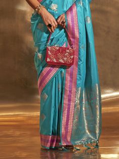 Elevate your style with our stunning sky-blue zari weaving satin function wear saree with blouse. This gorgeous ensemble is perfect for weddings, festivals, and other special occasions. The sky-blue color of the saree is truly mesmerizing and is complemented by the intricate zari weaving work, adding a touch of elegance and sophistication.
Crafted from high-quality satin material, the saree drapes beautifully and offers a comfortable fit. The matching silk blouse also features exquisite zari wea Elegant Blue Pre-draped Saree For Puja, Designer Light Blue Saree With Zari Work, Light Blue Unstitched Blouse Piece For Festivals, Festive Light Blue Saree With Unstitched Blouse, Light Blue Semi-stitched Blouse Piece For Festivals, Light Blue Semi-stitched Blouse For Festivals, Light Blue Blouse Piece With Zari Work For Festivals, Light Blue Unstitched Blouse For Diwali, Light Blue Pre-draped Saree With Zari Work